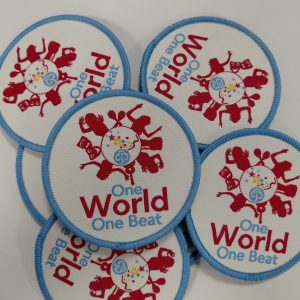 One world, one beat badge