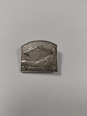 Our Chalet World Centre pin badge